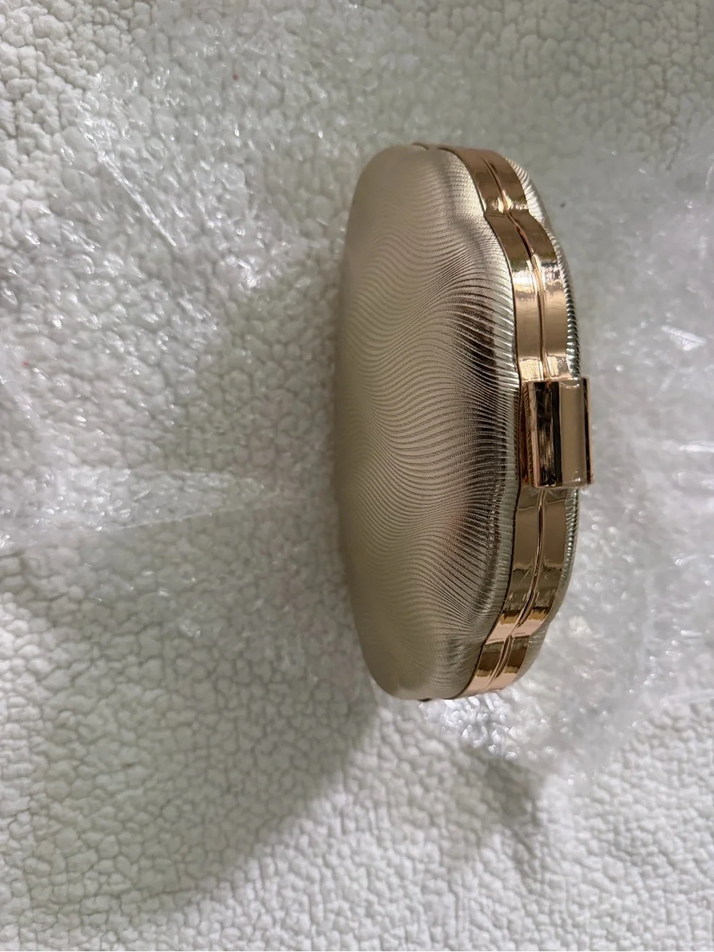 Gold Wave-Textured Evening Clutch with Top Clasp